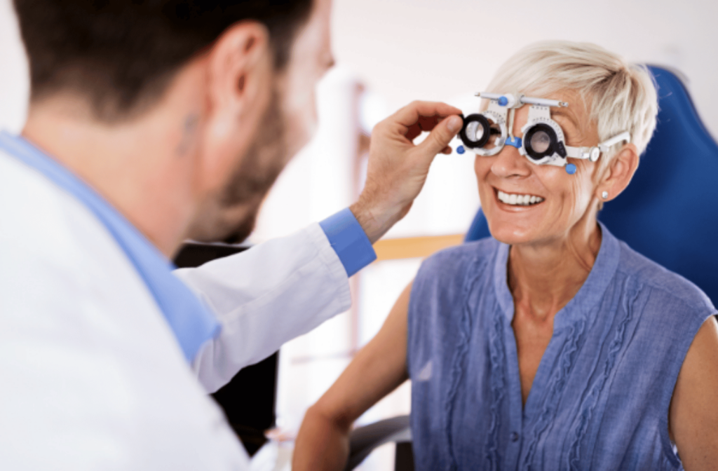 Eye doctor helps adjust a trial frame on a patient with myopia that got worse with age