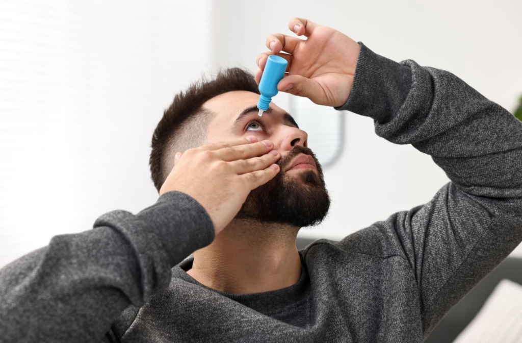 An adult uses prescription eye drops to help improve meibomian gland function.
